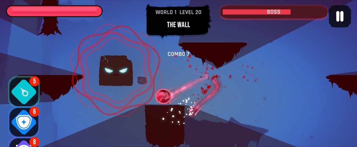 The Wall, a shielded boss block with glowing eyes, takes a hit from the orb